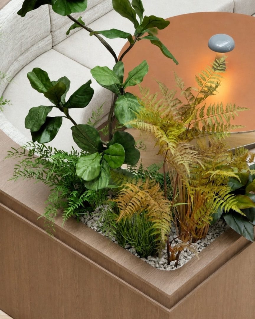 hjørne på buet modulsofa til kantine med kunstige planter
